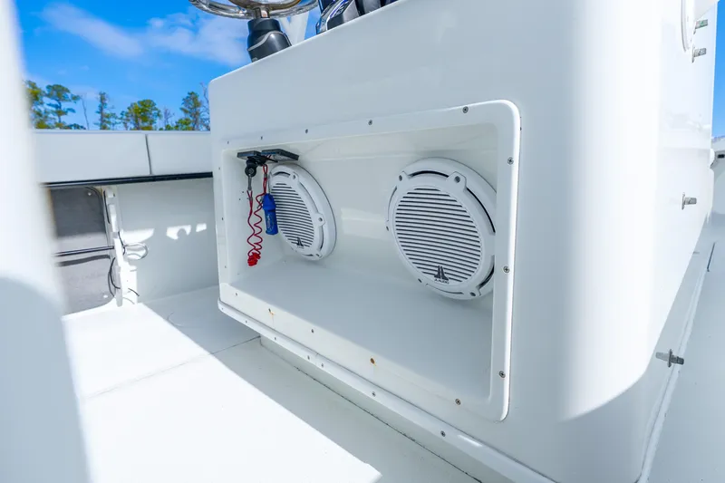 Slide: The Image of 2014 Yellowfin 32 Offshore boat interior with speakers and control panel. - 27