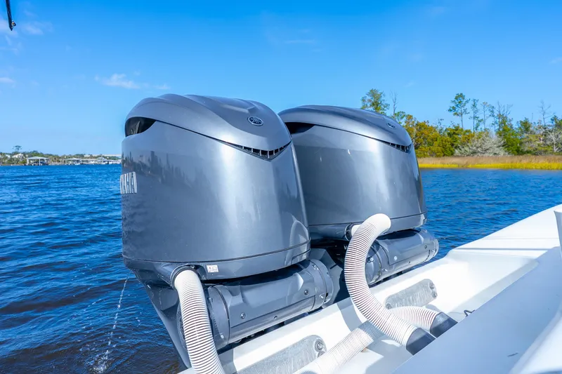 Slide: The Image of Twin Yamaha outboard engines on a 2014 Yellowfin 32 Offshore boat, cruising on a sunny day. - 36