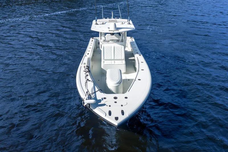 Slide: The Image of 2014 Yellowfin 32 Offshore boat on open water, aerial view. - 7