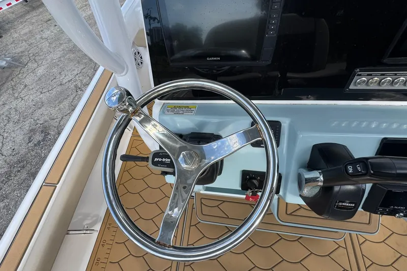 Slide: The Image of Steering console of 2022 Tidewater 2300 Carolina Bay boat with Garmin display. - 15