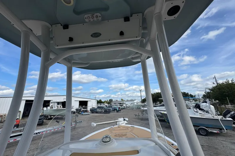 Slide: The Image of 2022 Tidewater 2300 Carolina Bay boat, view from helm, in a marina setting. - 17