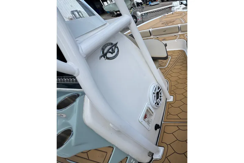 Slide: The Image of 2022 Tidewater 2300 Carolina Bay boat interior with custom flooring and speaker system. - 18