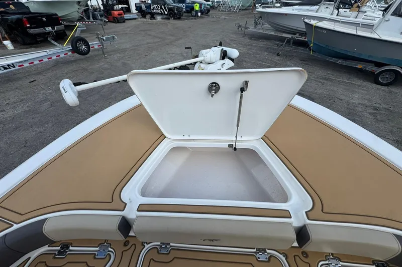 Slide: The Image of Open storage compartment on 2022 Tidewater 2300 Carolina Bay boat deck. - 25