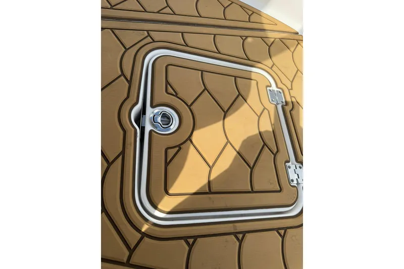 Slide: The Image of Hatch cover on 2022 Tidewater 2300 Carolina Bay boat with textured design. - 26