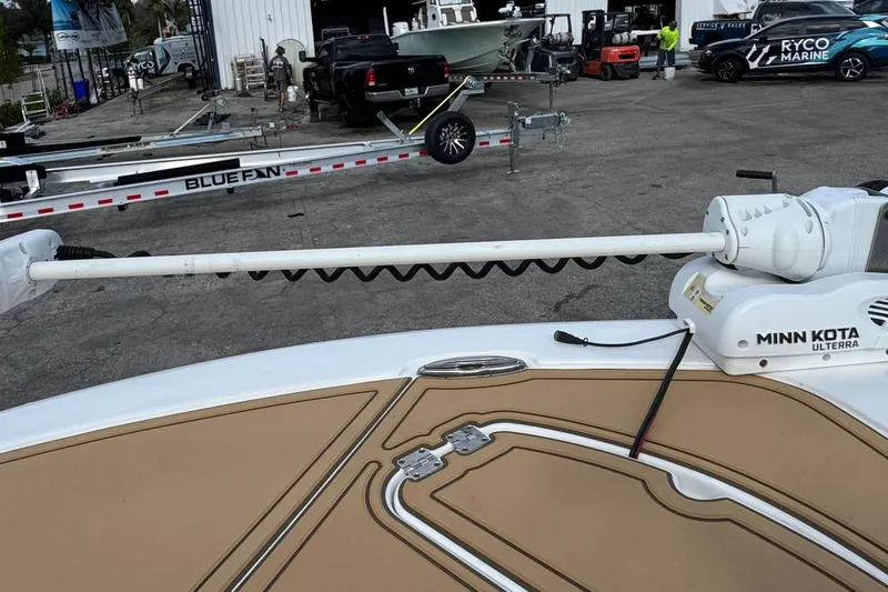 Slide: The Image of 2022 Tidewater 2300 Carolina Bay boat with Minn Kota Ulterra trolling motor at marina. - 28