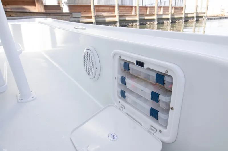 Slide: The Image of 2014 Yellowfin 24 Bay boat with storage compartments and speaker on deck. - 5