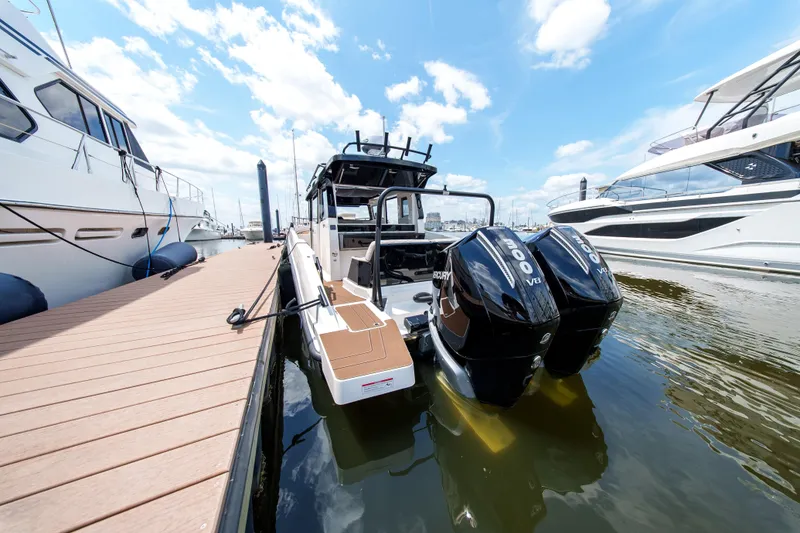 Slide: The Image of 2026 Navan C30 boat docked with twin Mercury V8 engines. - 11