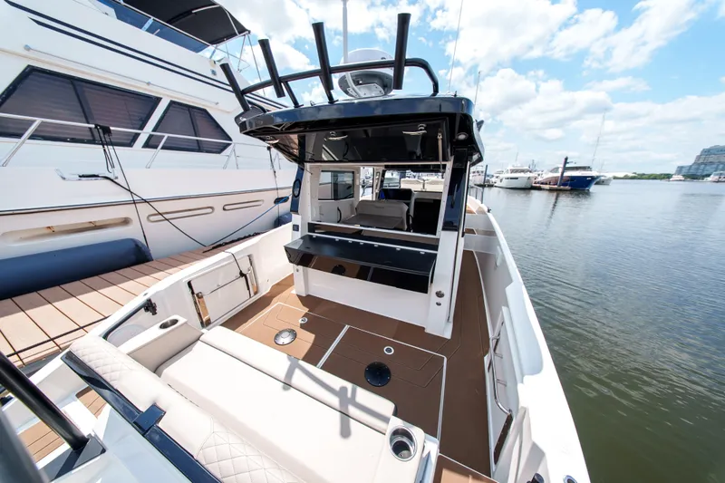 Slide: The Image of 2026 Navan C30 boat docked at marina, featuring spacious deck and modern design. - 14