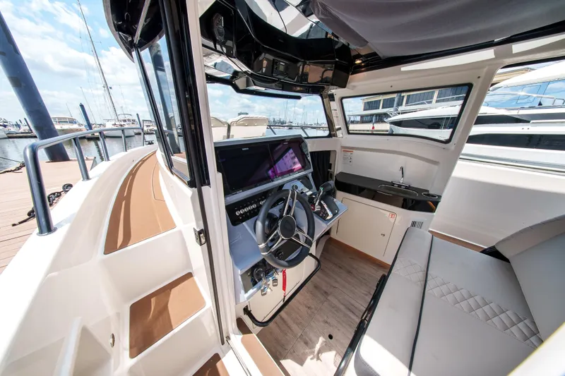 Slide: The Image of Interior of 2026 Navan C30 boat with modern helm and seating area. - 20