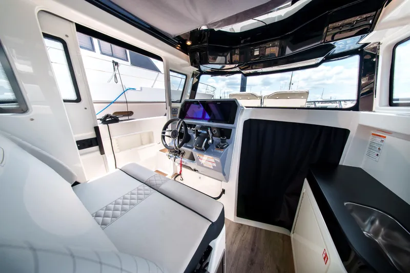 Slide: The Image of Interior of 2026 Navan C30 boat with modern helm and seating area. - 31