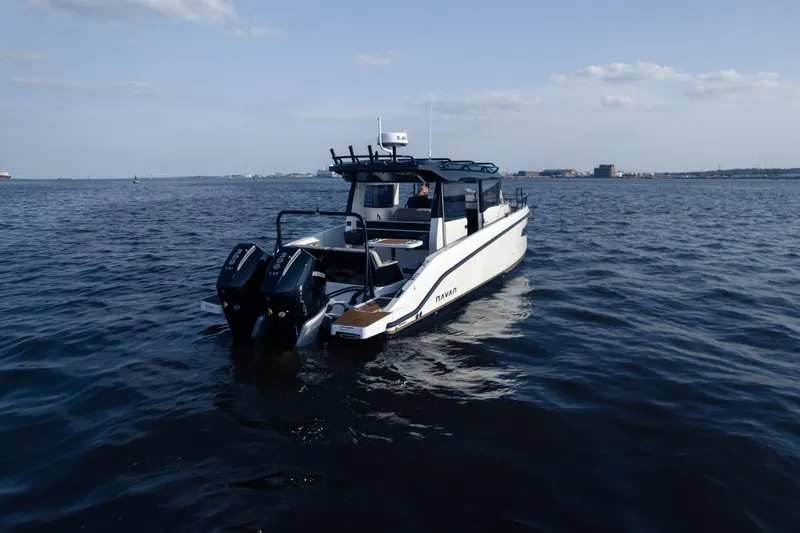 Slide: The Image of 2026 Navan C30 boat on open water, featuring dual outboard motors. - 41