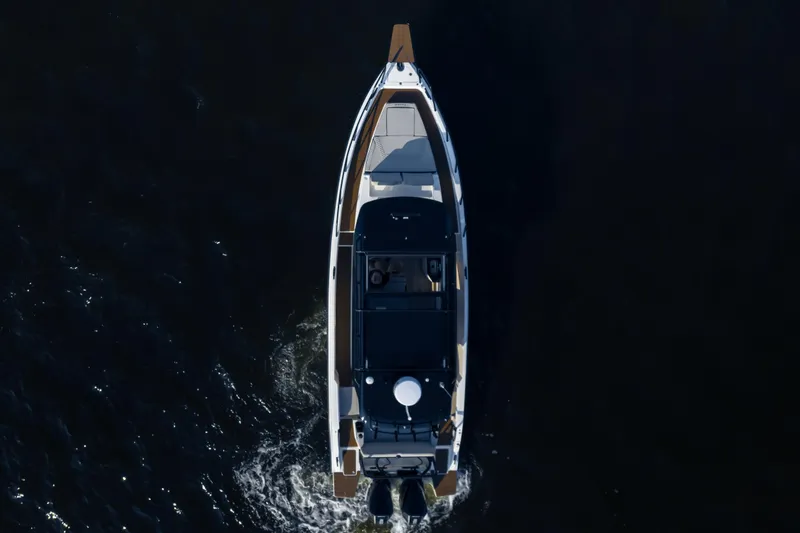 Slide: The Image of Overhead view of 2026 Navan C30 boat cruising on dark water. - 48