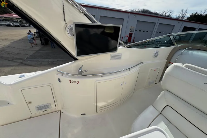 Slide: The Image of 2003 Riviera Cruiser M470 Excalibur interior with TV and seating area. - 13