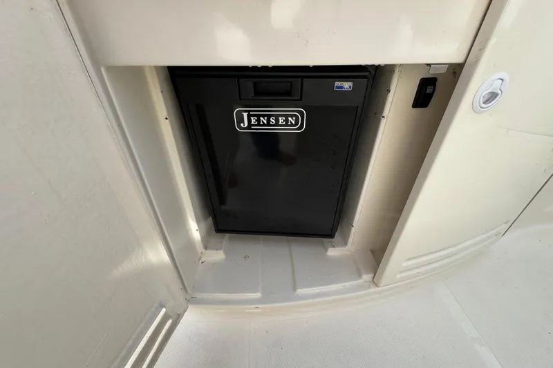 Slide: The Image of 2003 Riviera Cruiser M470 Excalibur with Jensen mini fridge in cabin. - 14