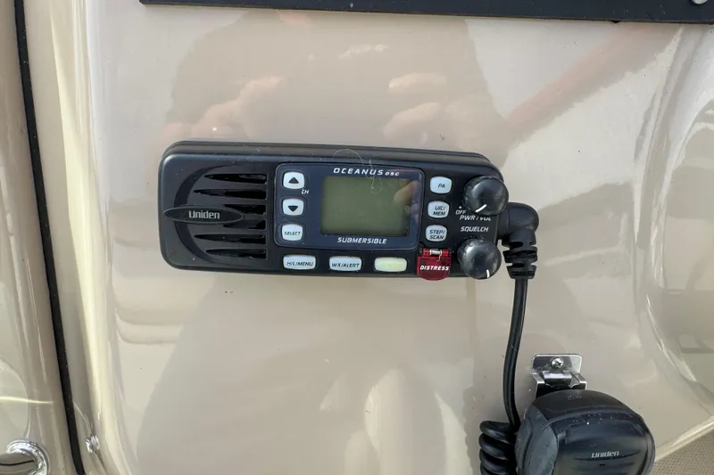 Slide: The Image of Uniden Oceanus DSC radio on 2003 Riviera Cruiser M470 Excalibur boat dashboard. - 21