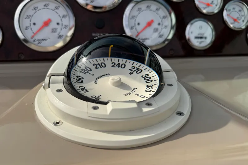 Slide: The Image of Compass and gauges on 2003 Riviera Cruiser M470 Excalibur dashboard. - 22