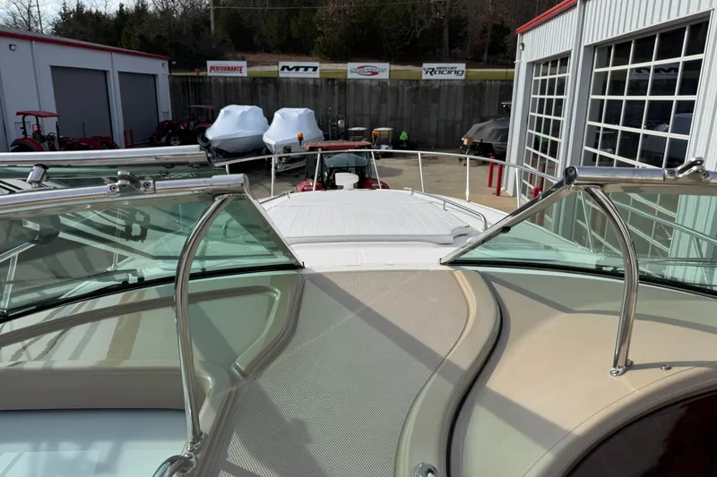 Slide: The Image of 2003 Riviera Cruiser M470 Excalibur boat at a marina with surrounding equipment. - 30