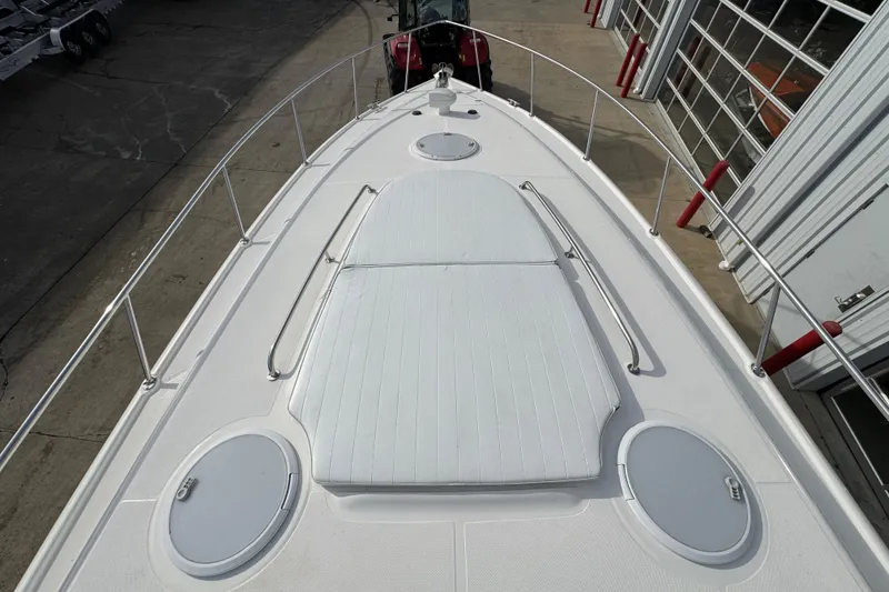 Slide: The Image of 2003 Riviera Cruiser M470 Excalibur boat deck with hatches and railings. - 31