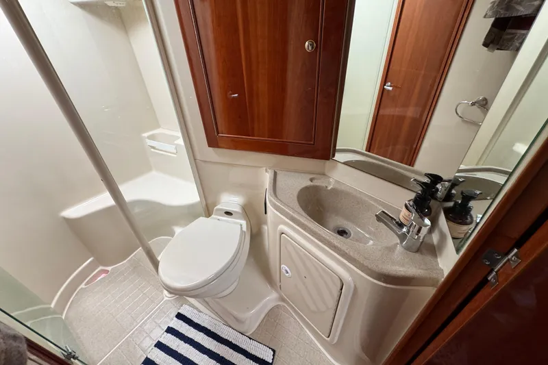 Slide: The Image of Bathroom interior of 2003 Riviera Cruiser M470 Excalibur with shower, sink, and toilet. - 43