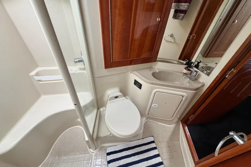 Slide: The Image of 2003 Riviera Cruiser M470 Excalibur bathroom with shower, toilet, and sink. - 45