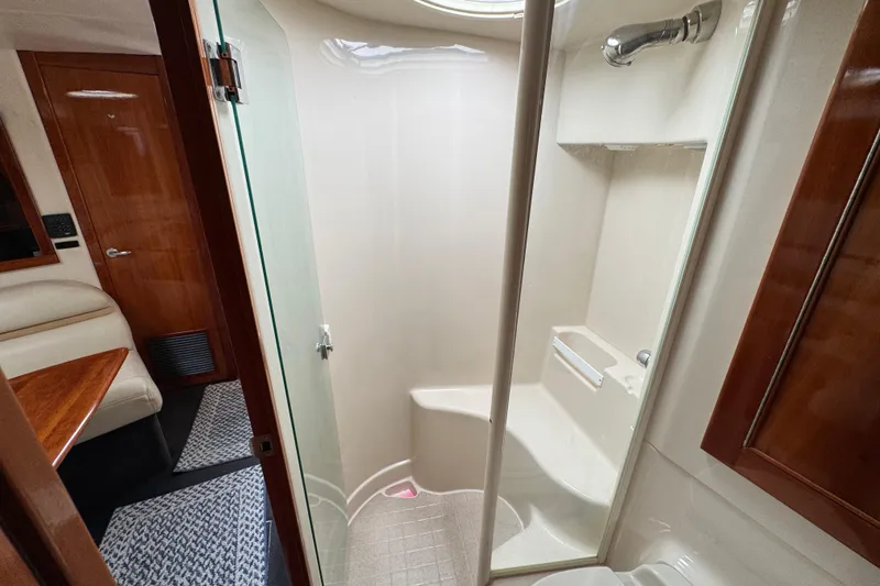 Slide: The Image of 2003 Riviera Cruiser M470 Excalibur yacht interior with shower and seating area. - 46