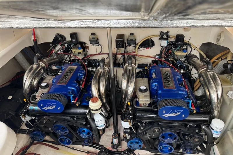 Slide: The Image of Twin engines in a 2003 Riviera Cruiser M470 Excalibur boat, showcasing detailed mechanics. - 6