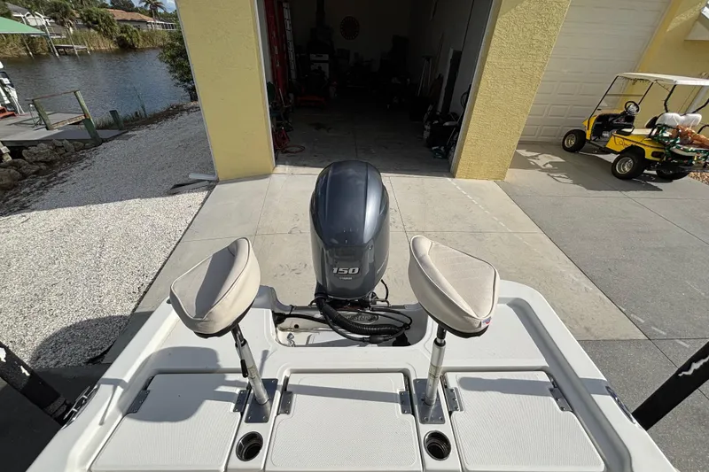 Slide: The Image of 2017 NauticStar 215 XTS Shallow Bay boat with dual seats and Yamaha 150 engine. - 21
