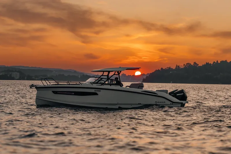 Slide: The Image of Navan S30 boat cruising at sunset, 2026 model, on serene waters. - 22
