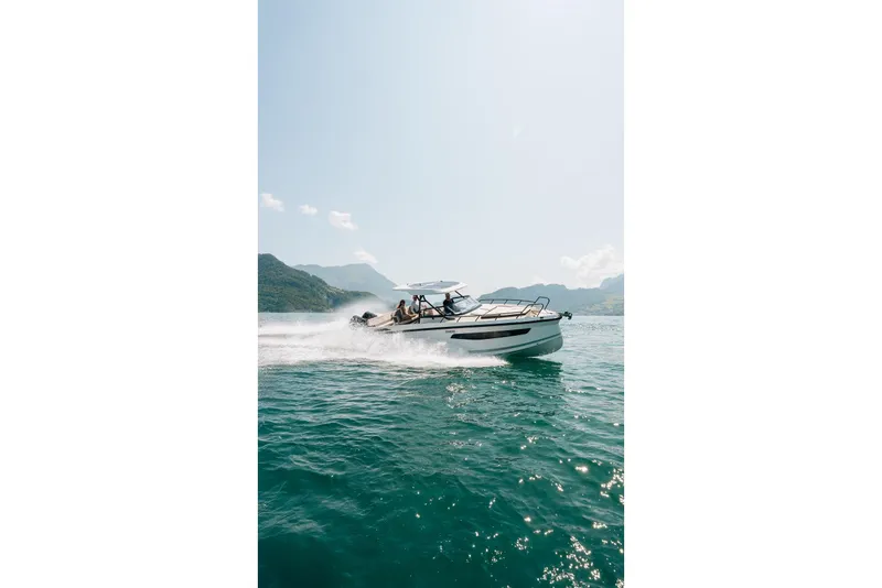 Slide: The Image of Navan S30 2026 boat cruising on a scenic lake with mountains in the background. - 42