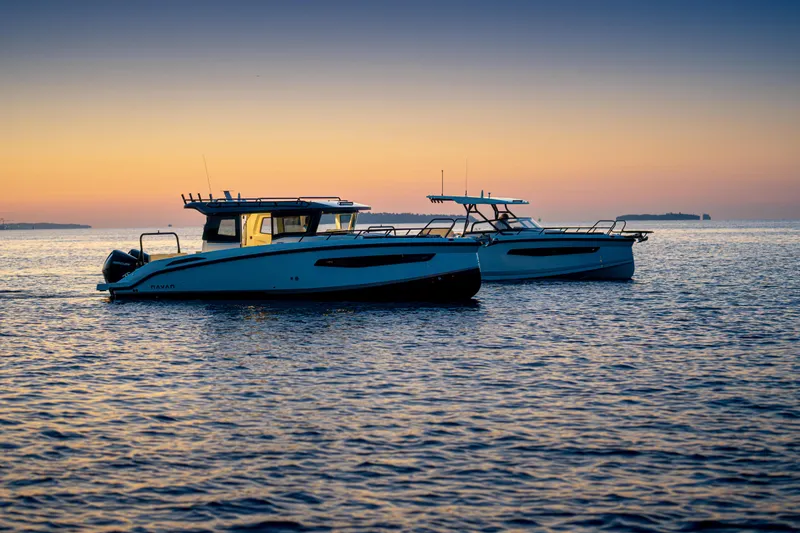 Slide: The Image of Two Navan S30 boats on calm water at sunset, 2026 model. - 47