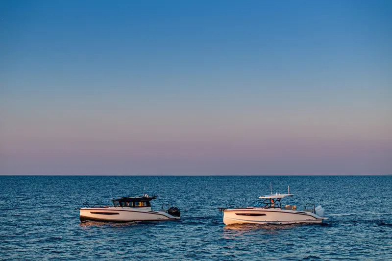 Slide: The Image of Two Navan S30 boats on calm sea at sunset, 2026 model. - 48