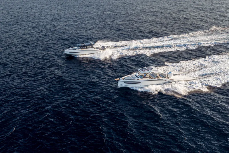 Slide: The Image of Two Navan S30 boats cruising on open water, 2026 model. - 49