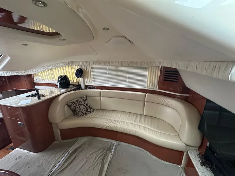 Slide: The Image of Luxurious interior of 2004 Sea Ray 390 Motor Yacht with leather seating and elegant design. - 13