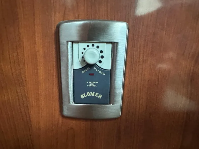 Slide: The Image of Glomex TV antenna control on 2004 Sea Ray 390 Motor Yacht interior panel. - 17