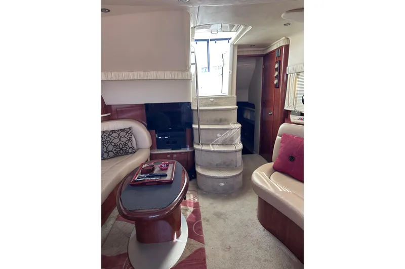 Slide: The Image of Interior of 2004 Sea Ray 390 Motor Yacht with elegant seating and staircase. - 8