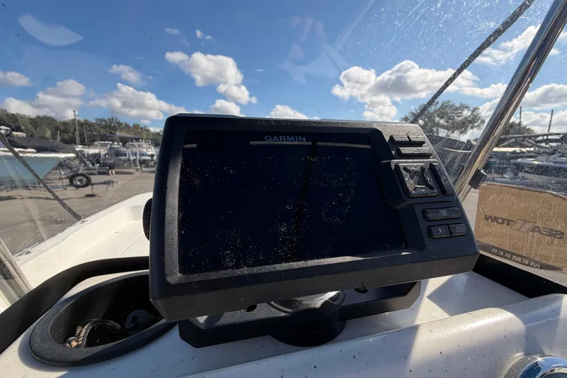 Slide: The Image of 2019 Mako Pro Skiff 15 CC boat interior with steering console and seating. - 13