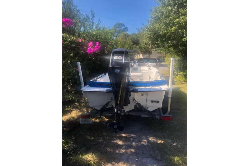 Slide: The Image of 2019 Mako Pro Skiff 15 CC with Mercury FourStroke engine, parked on a trailer. - 3