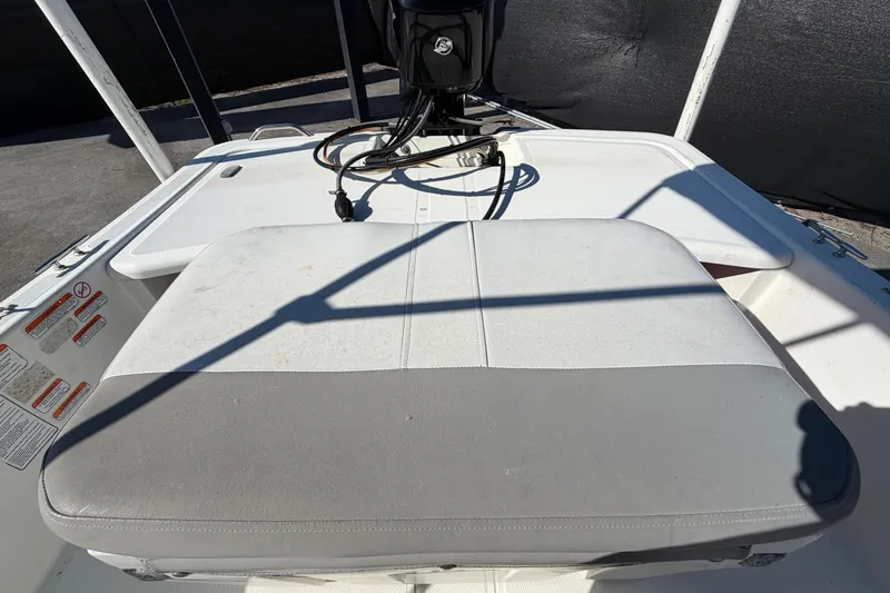 Slide: The Image of 2019 Mako Pro Skiff 15 CC, open storage compartment on deck. - 31