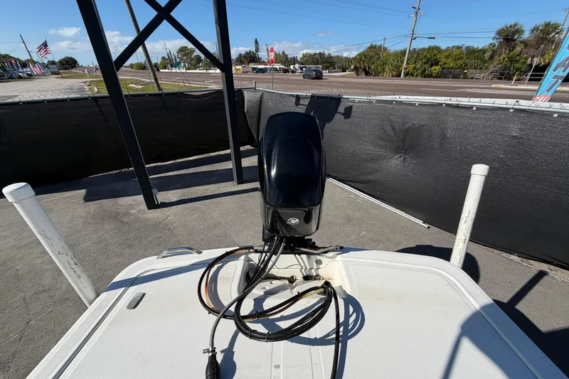 Slide: The Image of Open storage compartment on 2019 Mako Pro Skiff 15 CC boat, showing wear and debris. - 32