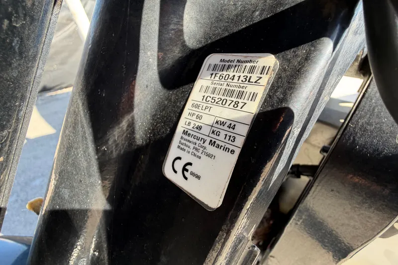 Slide: The Image of 2019 Mako Pro Skiff 15 CC boat interior with seating and trolling motor. - 34