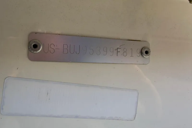 Slide: The Image of 2019 Mako Pro Skiff 15 CC boat seat, white and gray upholstery. - 35