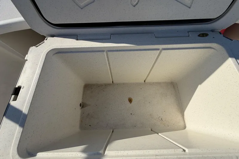 Slide: The Image of Open storage compartment on a 2019 Mako Pro Skiff 15 CC boat. - 41