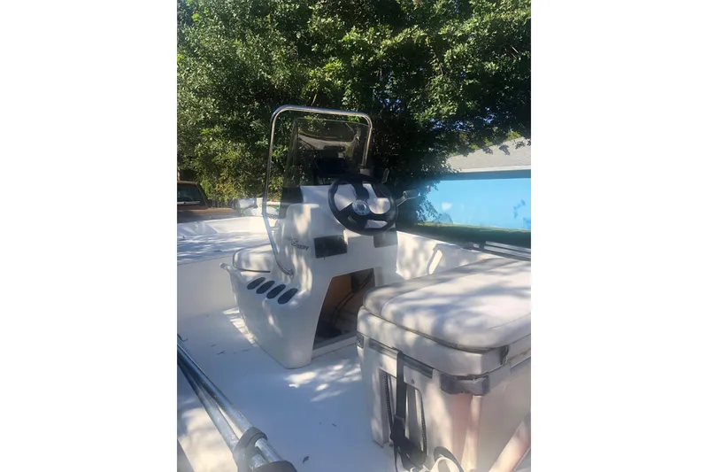 Slide: The Image of 2019 Mako Pro Skiff 15 CC with 60 HP engine, outdoor display. - 5