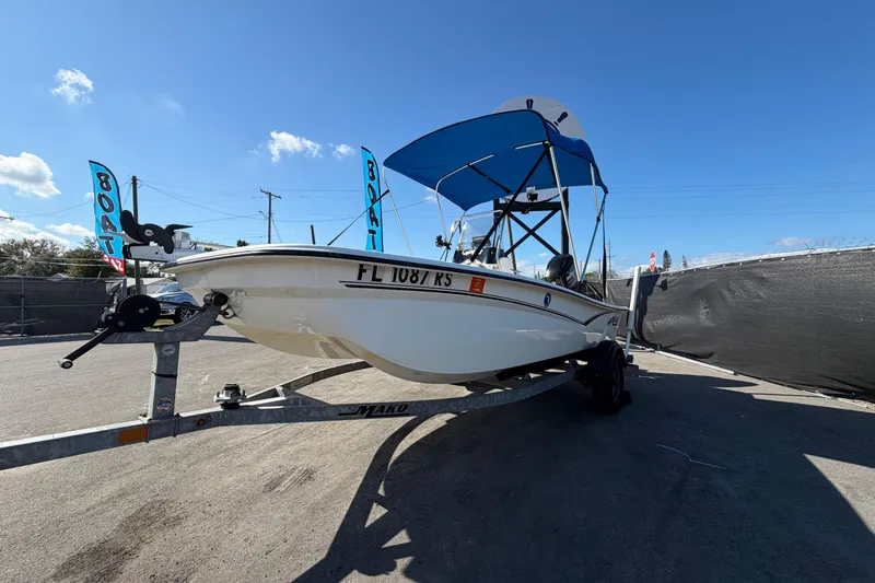 Slide: The Image of 2019 Mako Pro Skiff 15 CC with Mercury FourStroke engine, parked outdoors. - 7