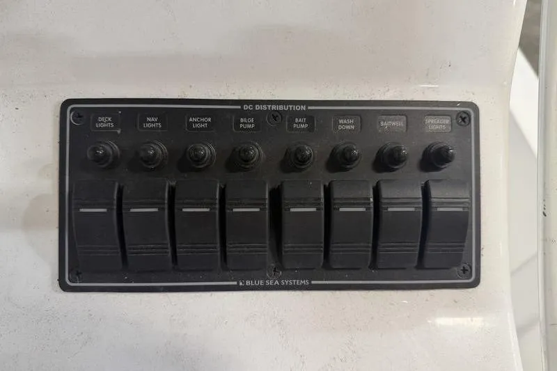 Slide: The Image of Control panel of a 2023 Panga 22 SPORT boat with labeled switches for various functions. - 13