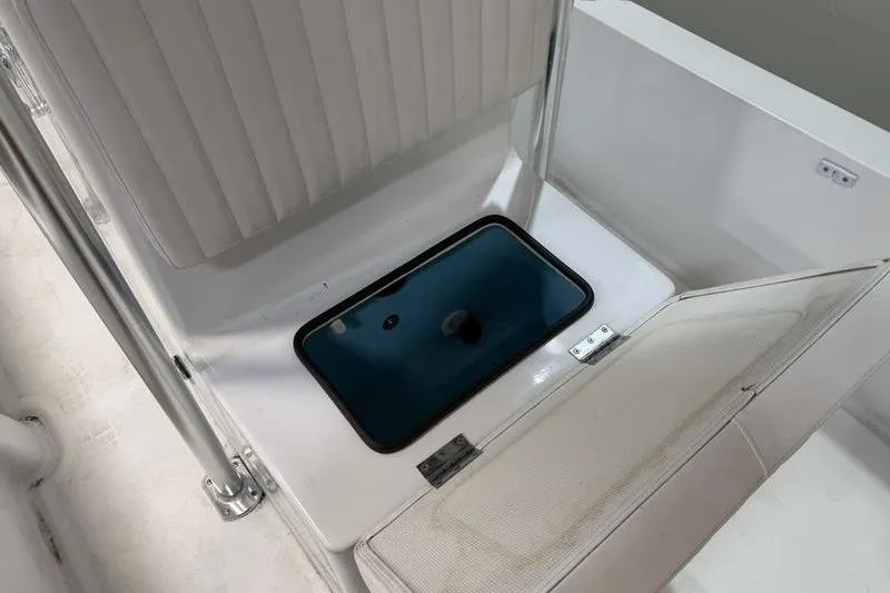 Slide: The Image of 2023 Panga 22 SPORT boat interior with open storage compartment. - 16