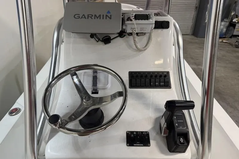 Slide: The Image of 2023 Panga 22 SPORT boat console with Garmin GPS and Honda controls. - 9