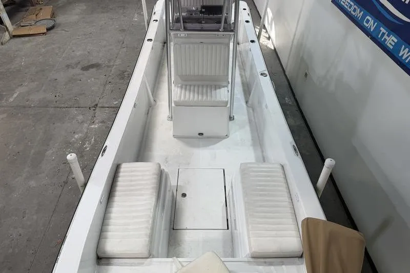 Slide: The Image of 2023 Panga 22 SPORT boat interior with white seating and center console. - 14