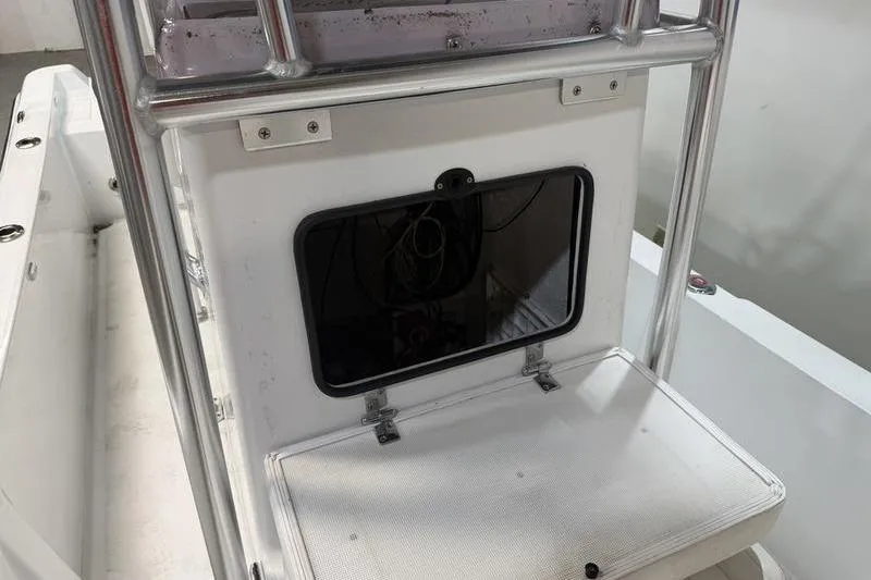 Slide: The Image of 2023 Panga 22 SPORT boat console with open storage compartment. - 15