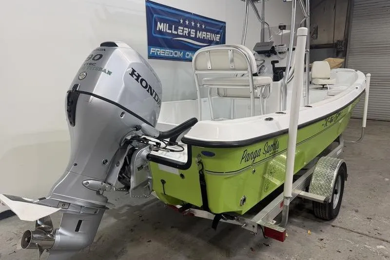Slide: The Image of 2023 Panga 22 SPORT boat with Honda engine on trailer in garage. - 5
